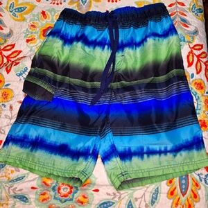 A Kanu Surf men's swim trunks in a size medium. They're pre-loved in great shape